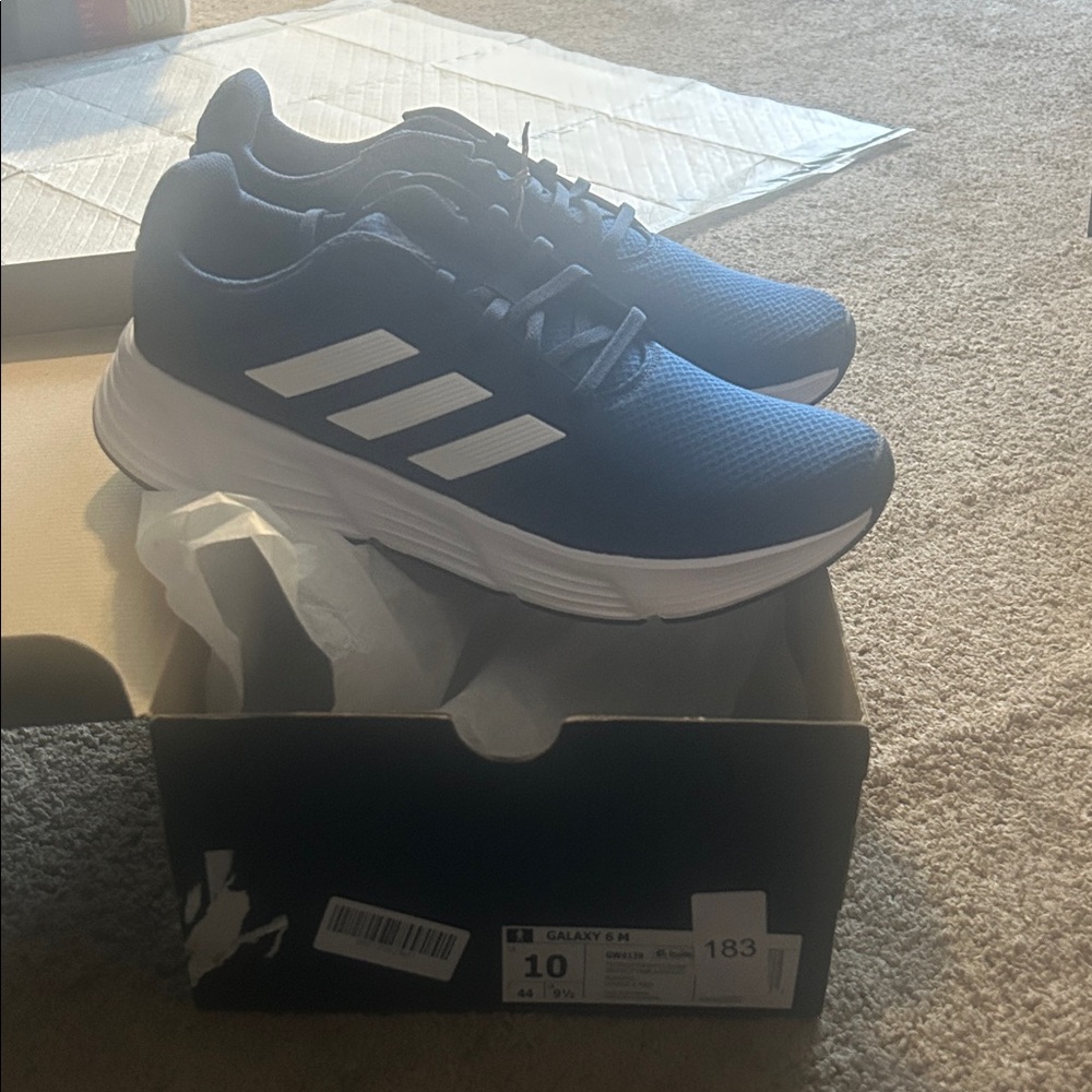 Men’s and women’s Adidas Galaxy Blue Sneakers with White Stripes